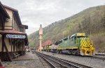 RBMN Freight Power adjacent to the main line track and station platform